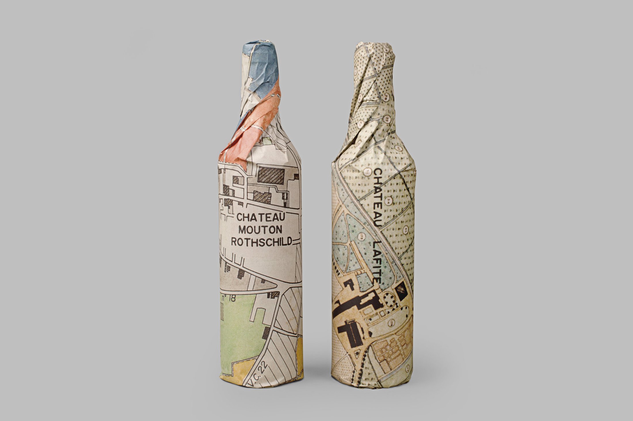 Innovative wine packaging for Château Lafite Rothschild and Château Mouton Rothschild, using vintage maps of the respective vineyards.
